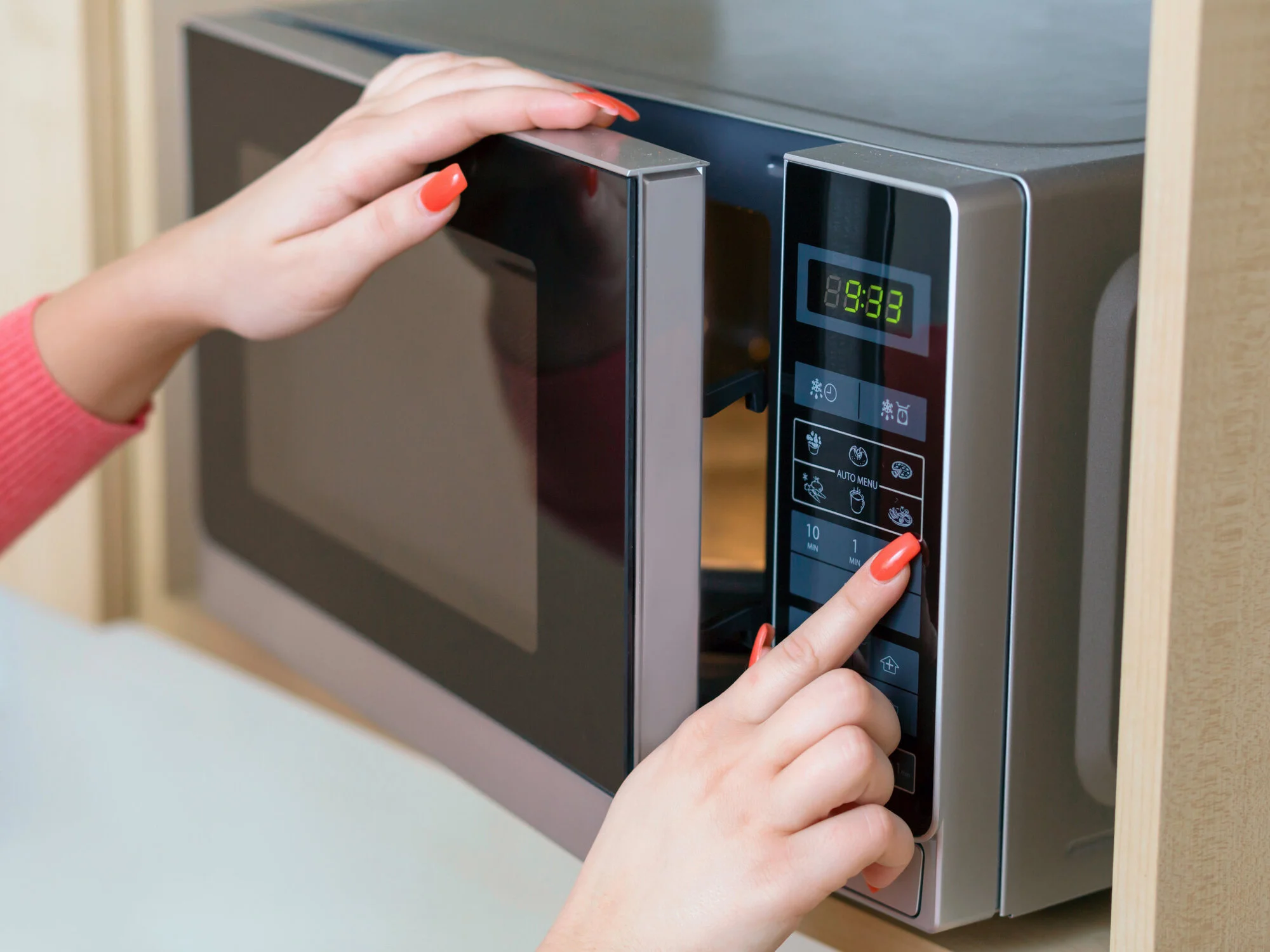 Person inspecting a used oven door seal