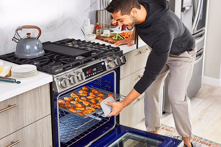 Cooked food in an oven-safe dish, covered with foil